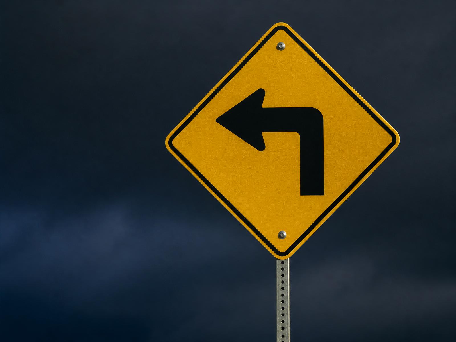 Left turn road sign representing a strategic change in direction